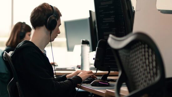 Two people working at computers